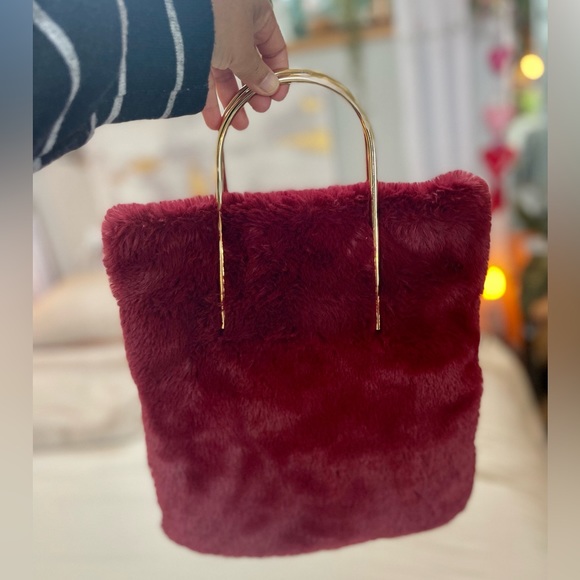 Handbags - Red Burgundy faux fur handbag. Interior pocket with zip closure.